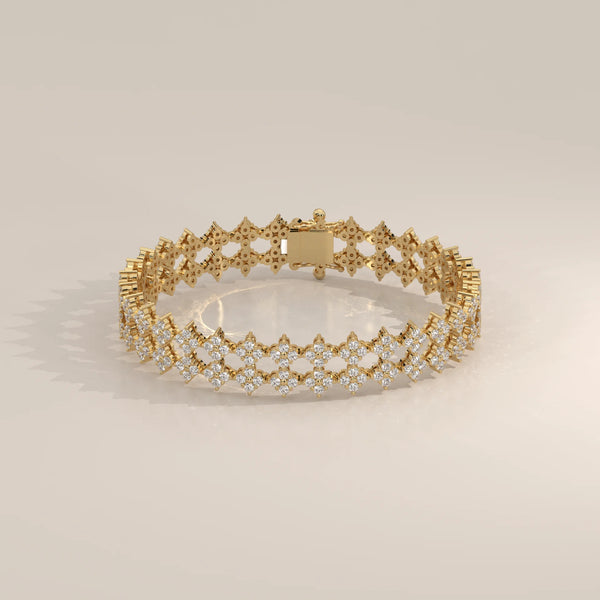 A delicate 14k gold bracelet encrusted with sparkling diamonds in an intricate pattern.