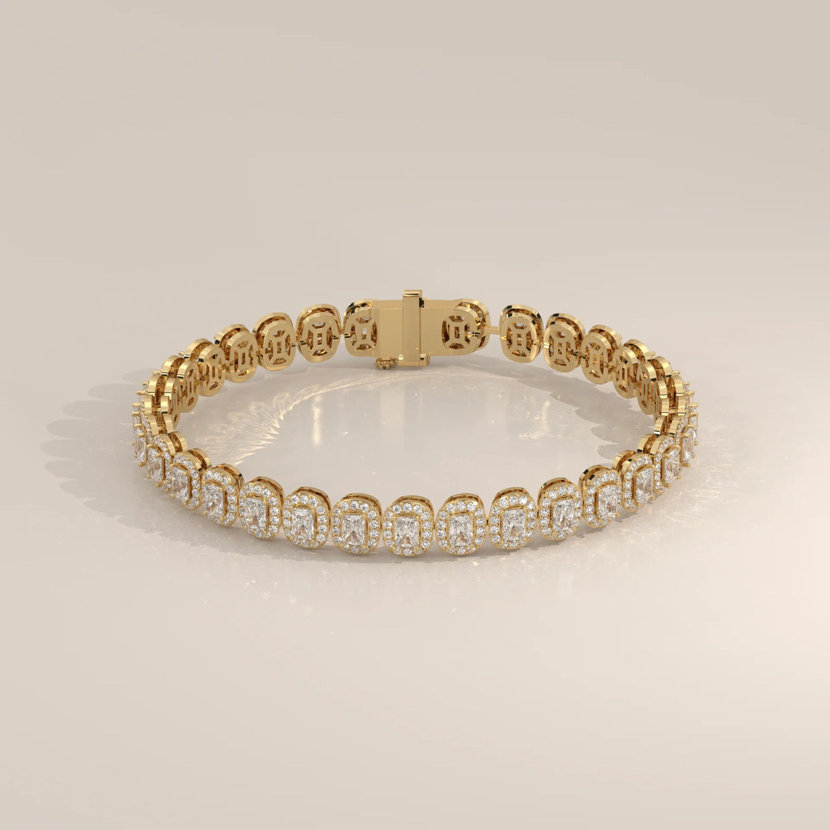 A delicate 14k gold tennis bracelet with rectangular and round diamonds.