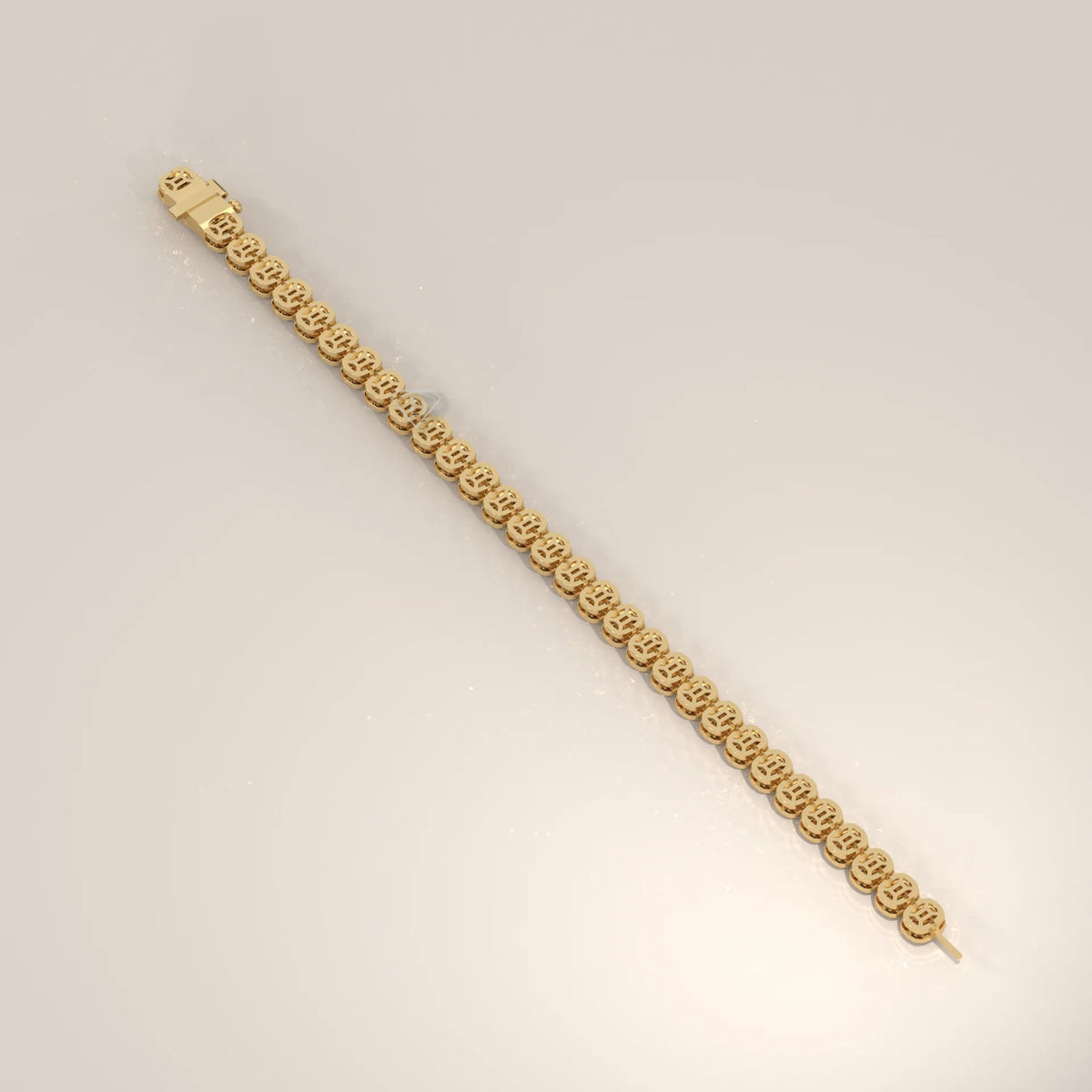 A gold bracelet with small smiley face charms, with a clasp closure.