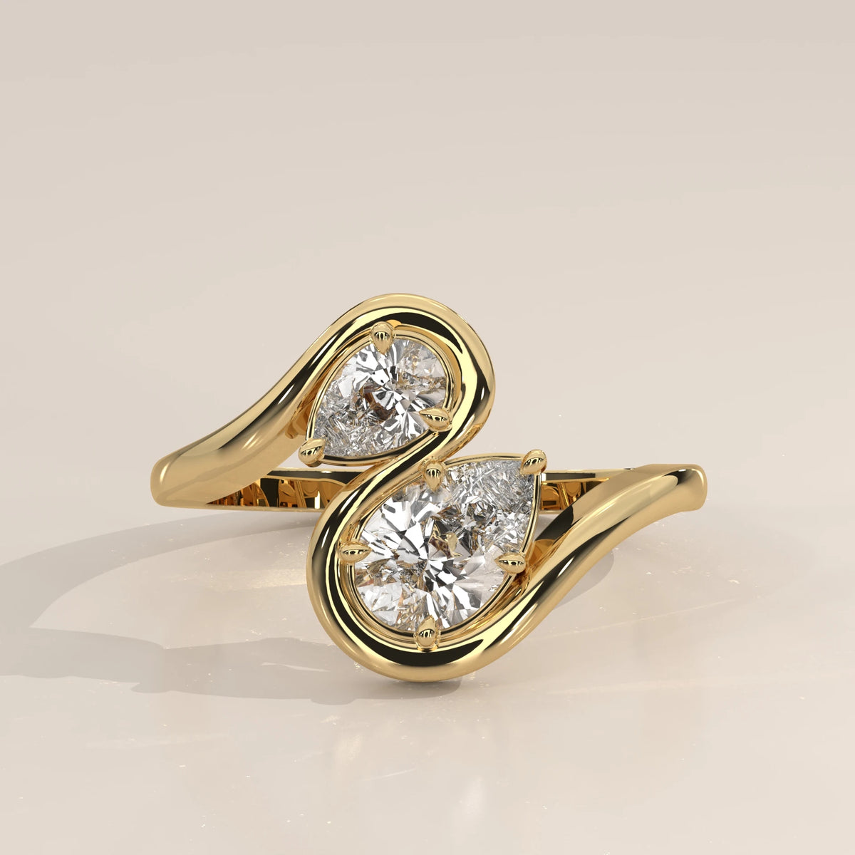 Yellow gold bypass ring with two pear-cut diamonds