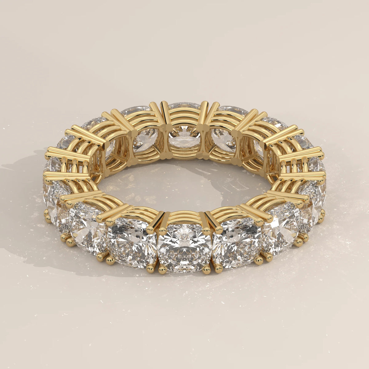 Chunky Cushion Square Diamond Eternity Ring with Bold Claws in yellow gold, shown at an angle.