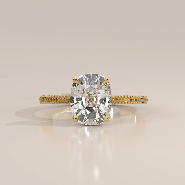 Yellow gold ring with a large, sparkling cushion-cut diamond.
