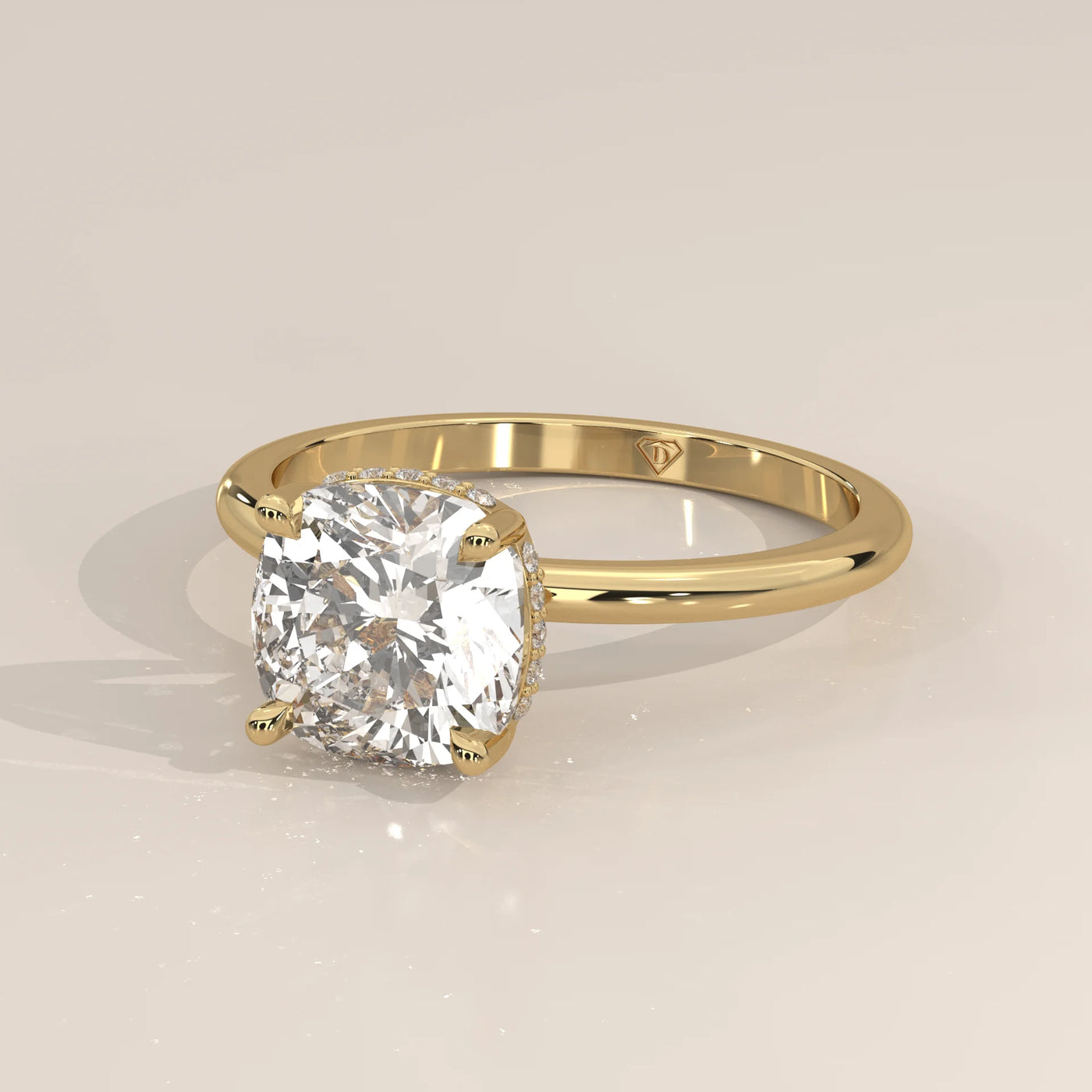 Yellow gold engagement ring with a large cushion-cut diamond.