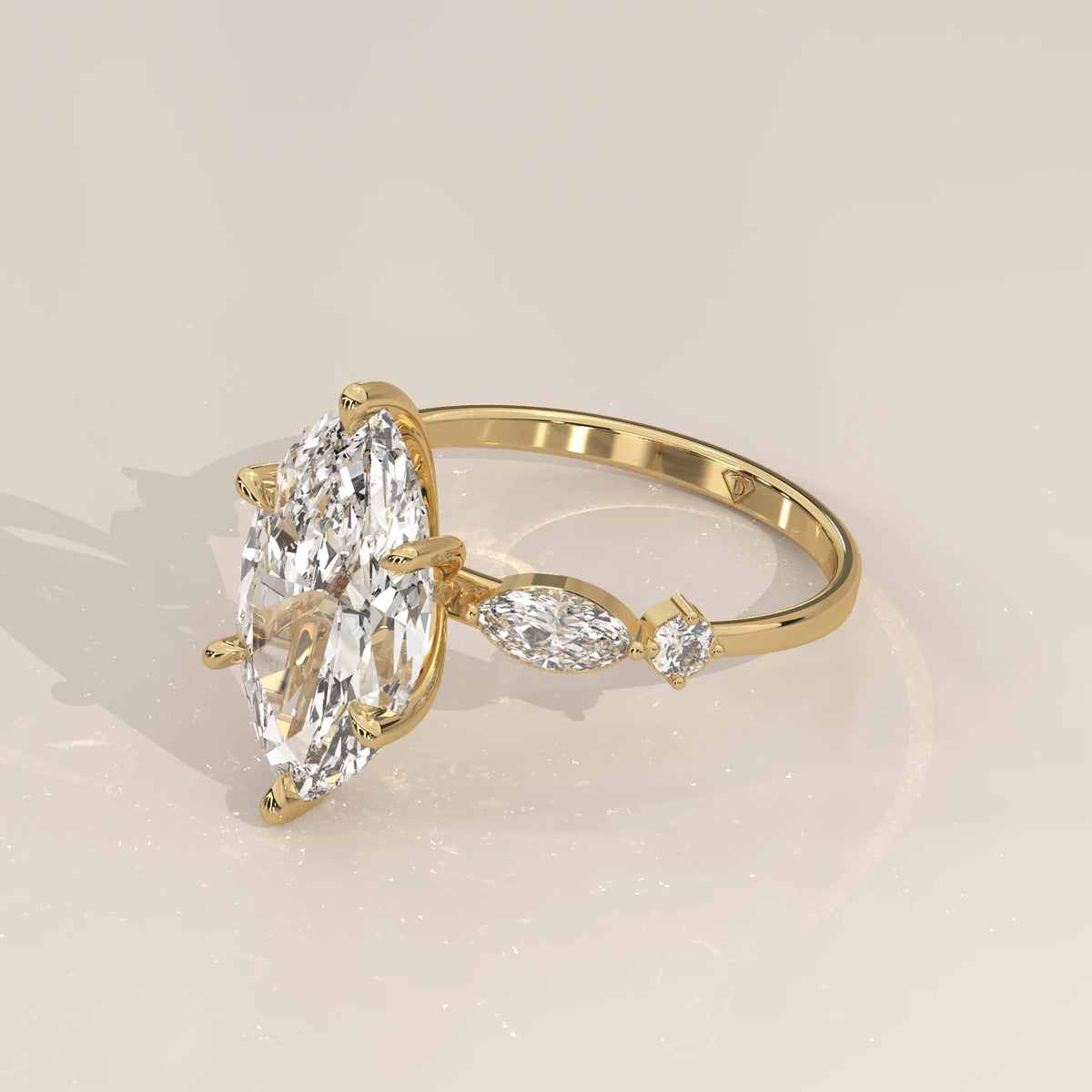 Daiva 5 Carat Marquise Lab Grown Diamond Ring, East West Accents in yellow gold, shown from the side.