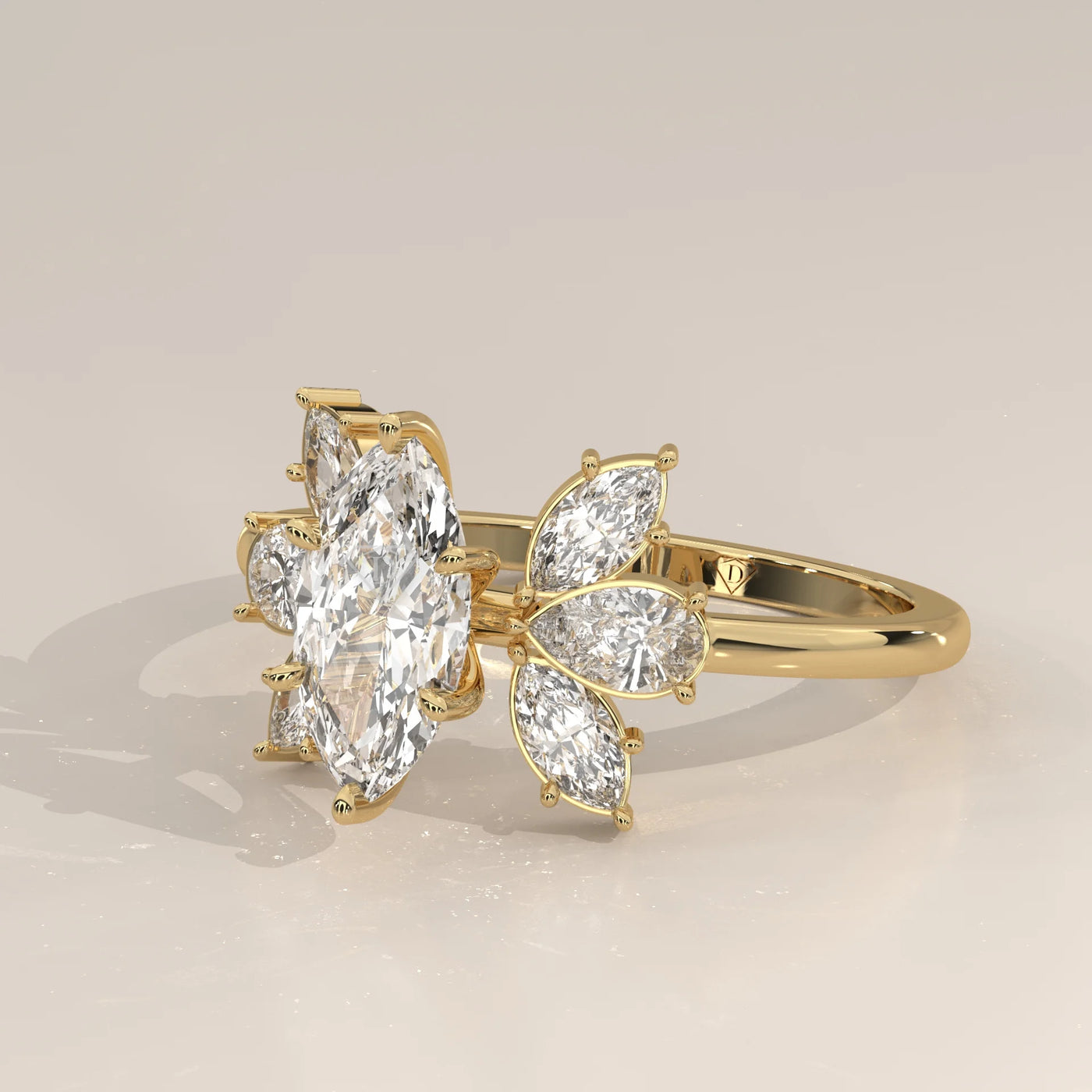 A delicate Marquise diamond cluster ring in 14k gold.