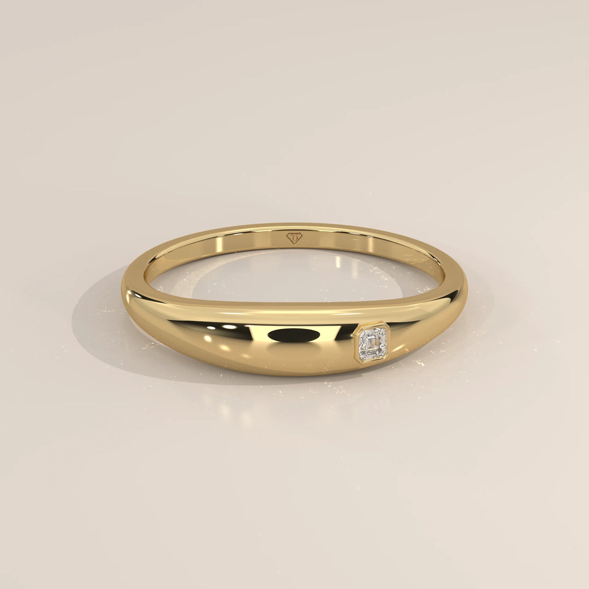 Domed Gold Band with a Flush Set Square Step Cut Diamond in yellow gold, shown from the front.