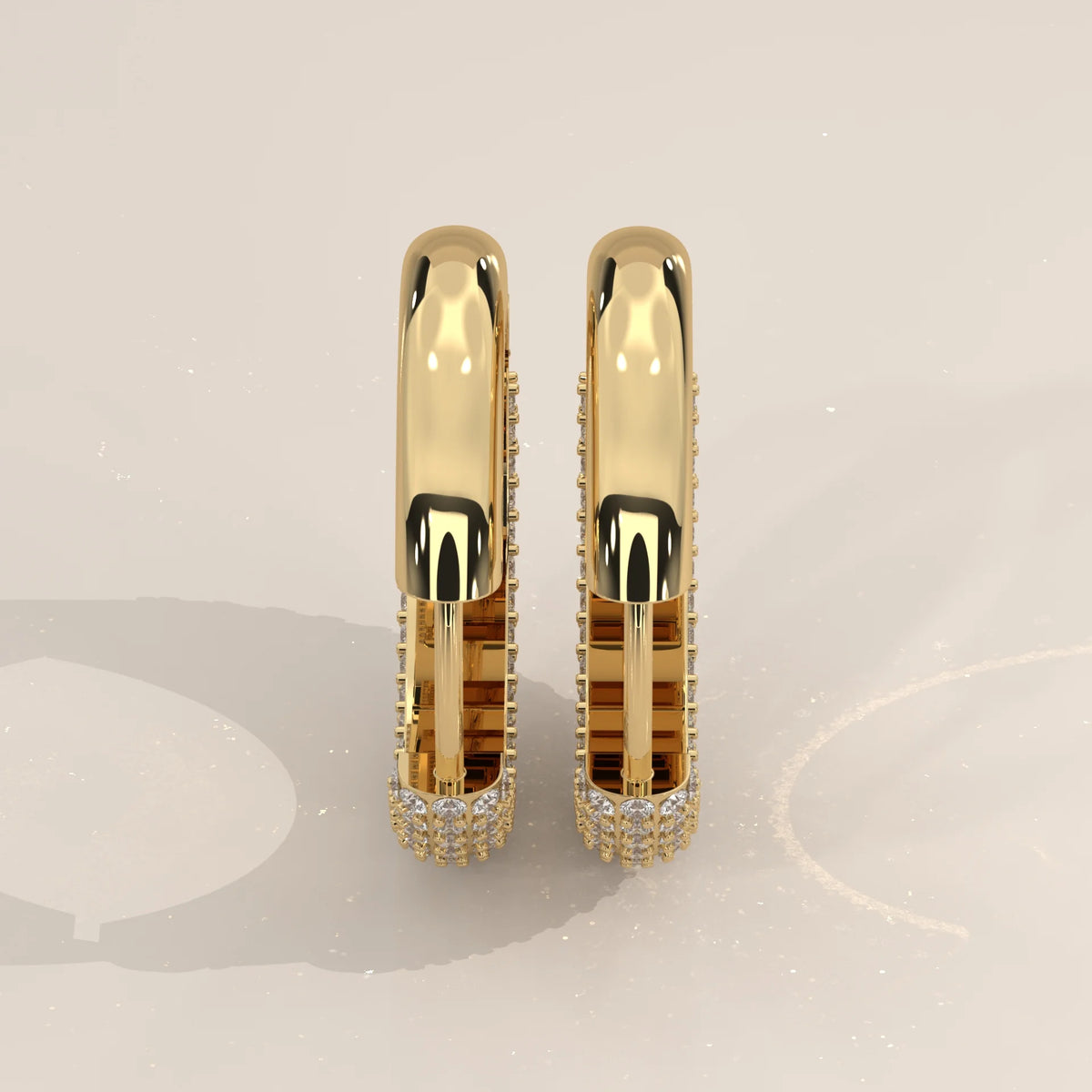Domed Pave Round Lab Grown Diamond Hoop Earrings with Hinged Snap in yellow gold, studio photograph on a plain background.