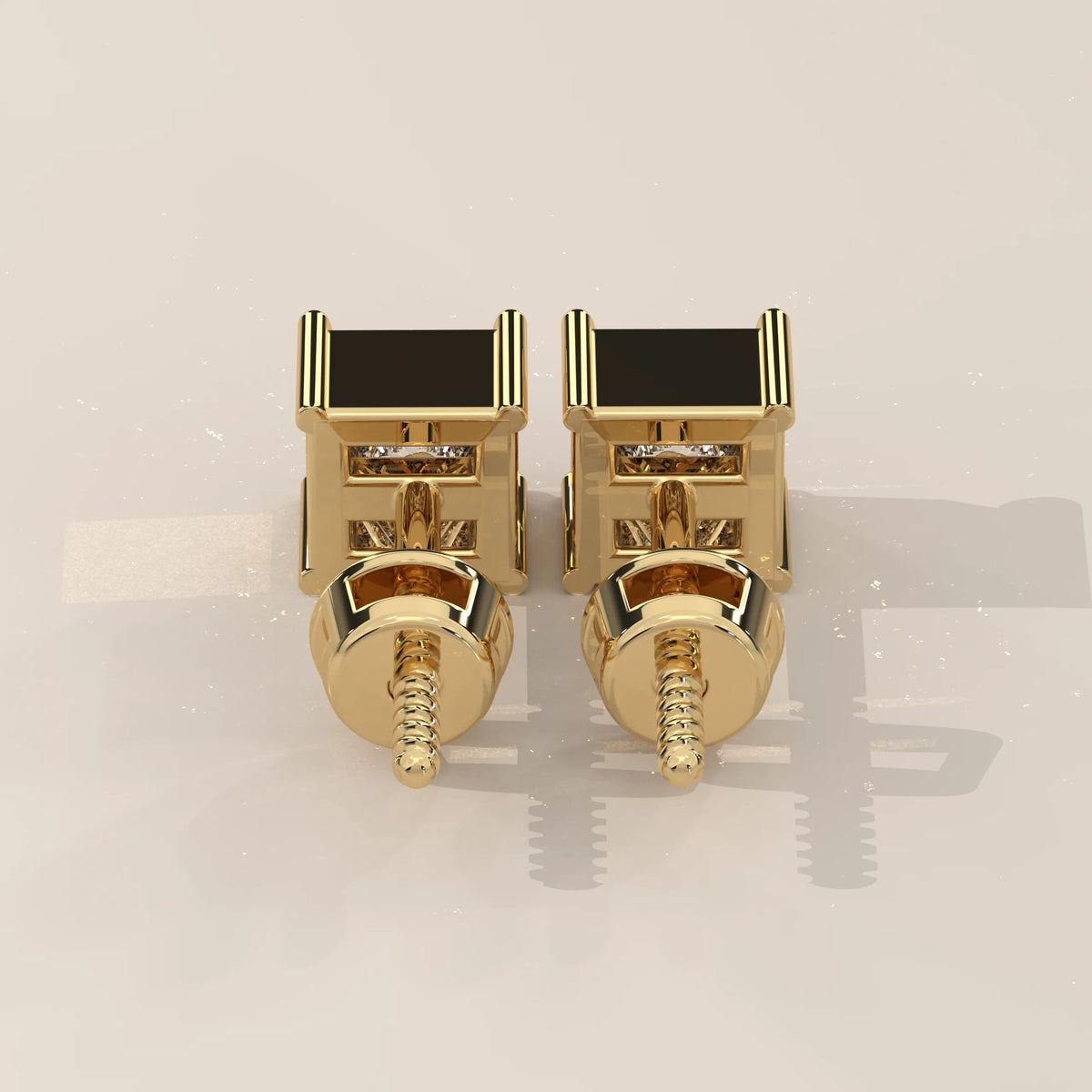 Pair of 14k gold square stud earrings with black onyx and diamonds.