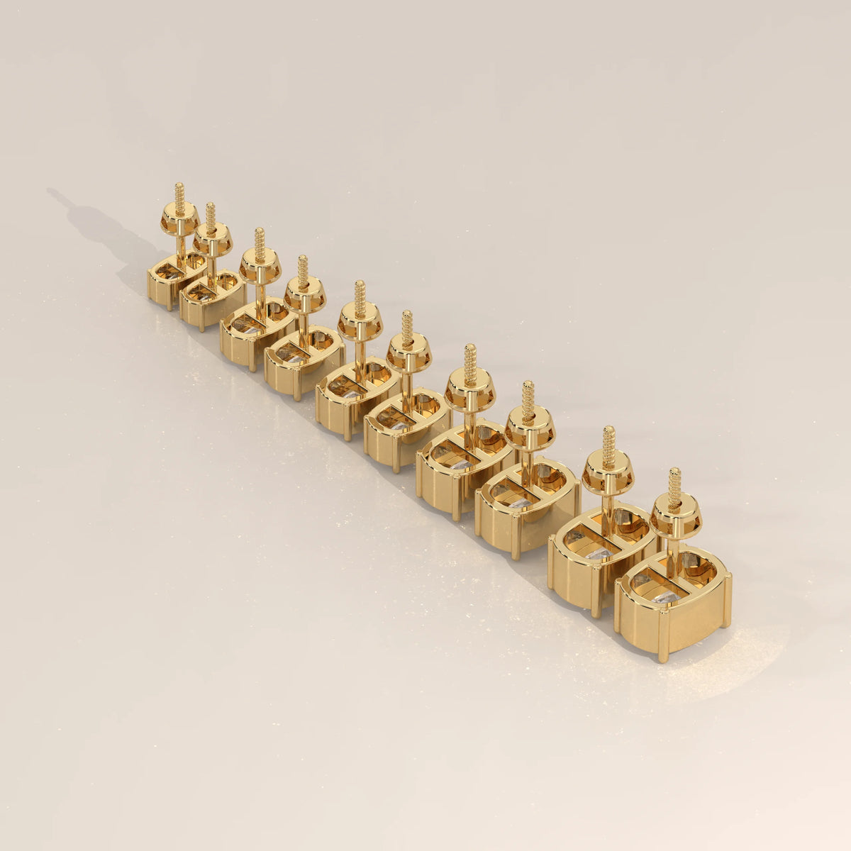 A row of 14k gold stud earrings with diamonds, arranged diagonally.