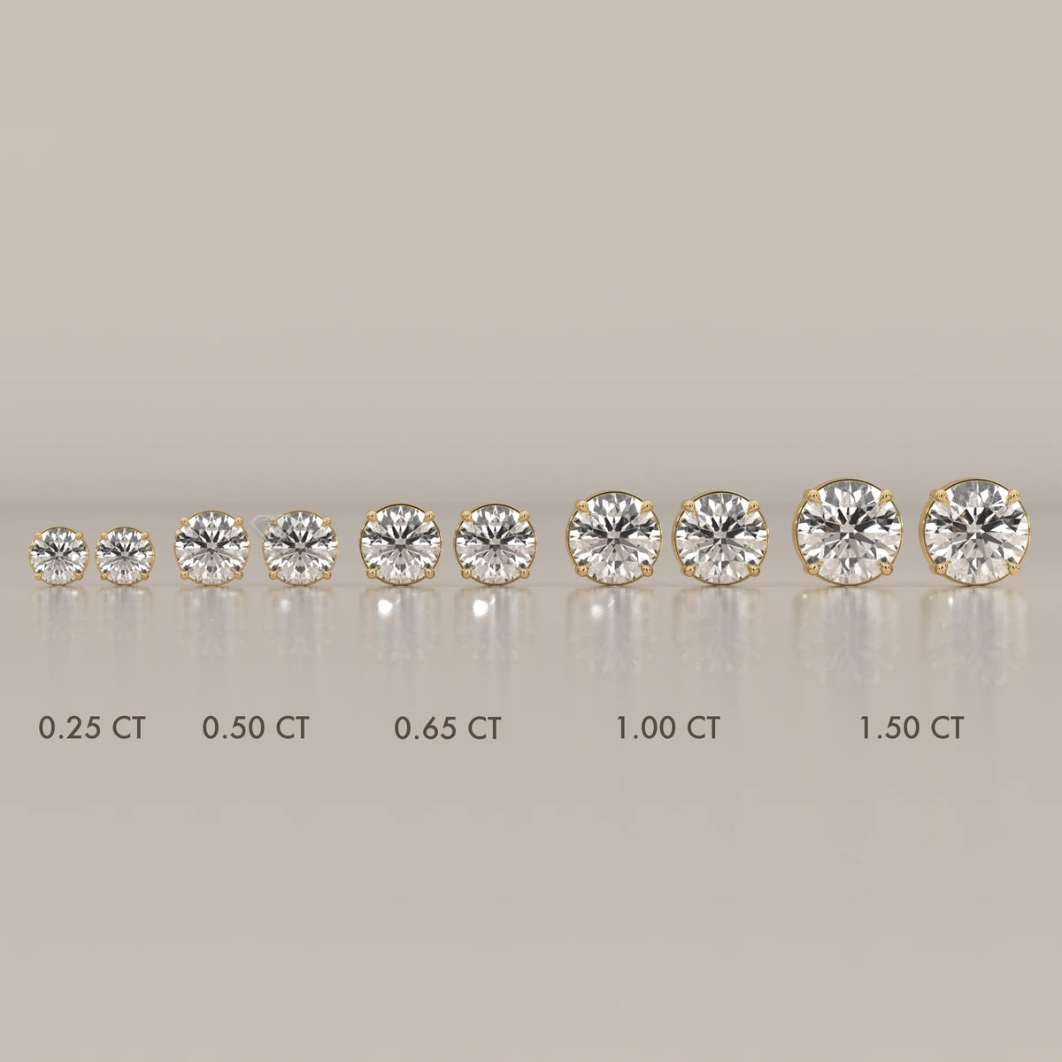 A line of round brilliant cut diamond stud earrings in gold settings.