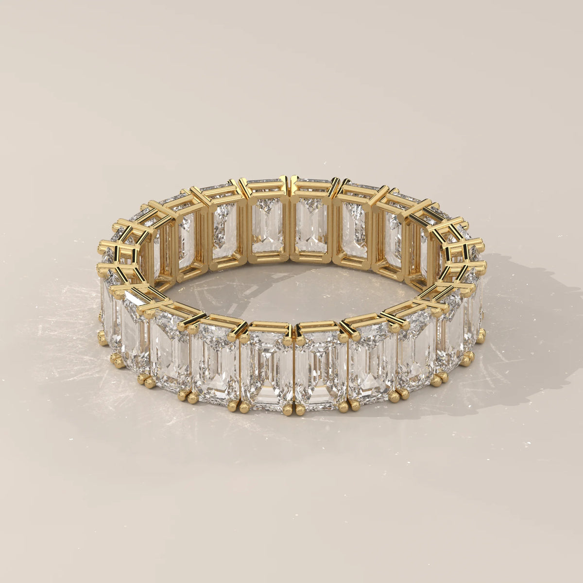 East West Emerald Cut Diamond Eternity Band in Solid Gold in yellow gold, shown on a plain background.