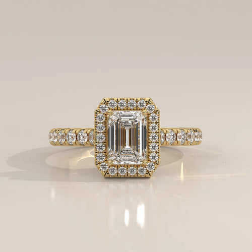 Emerald Cut Lab Grown Diamond Halo Ring with Pave Shank in yellow gold, photographed head-on.