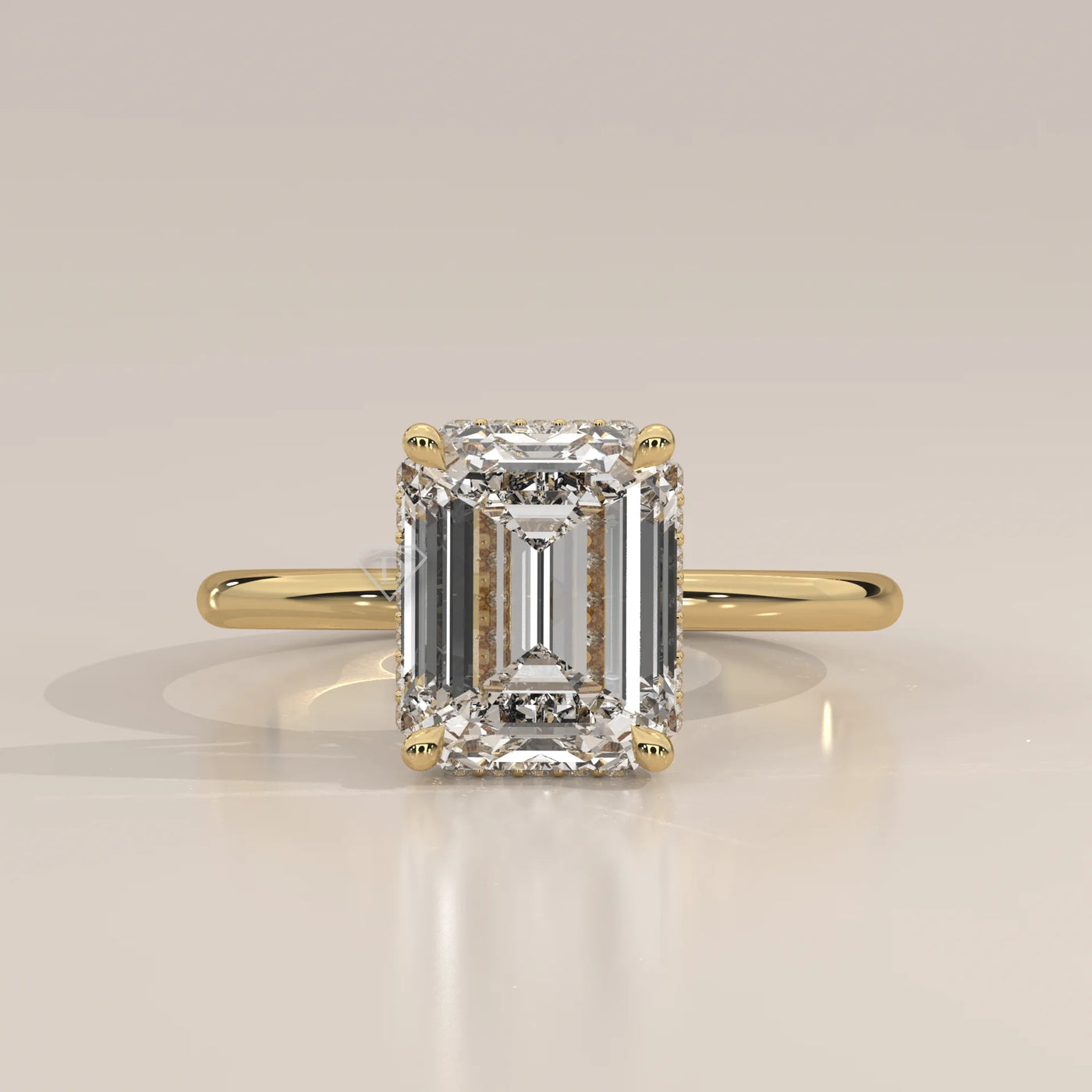 Emerald cut diamond engagement ring in yellow gold.