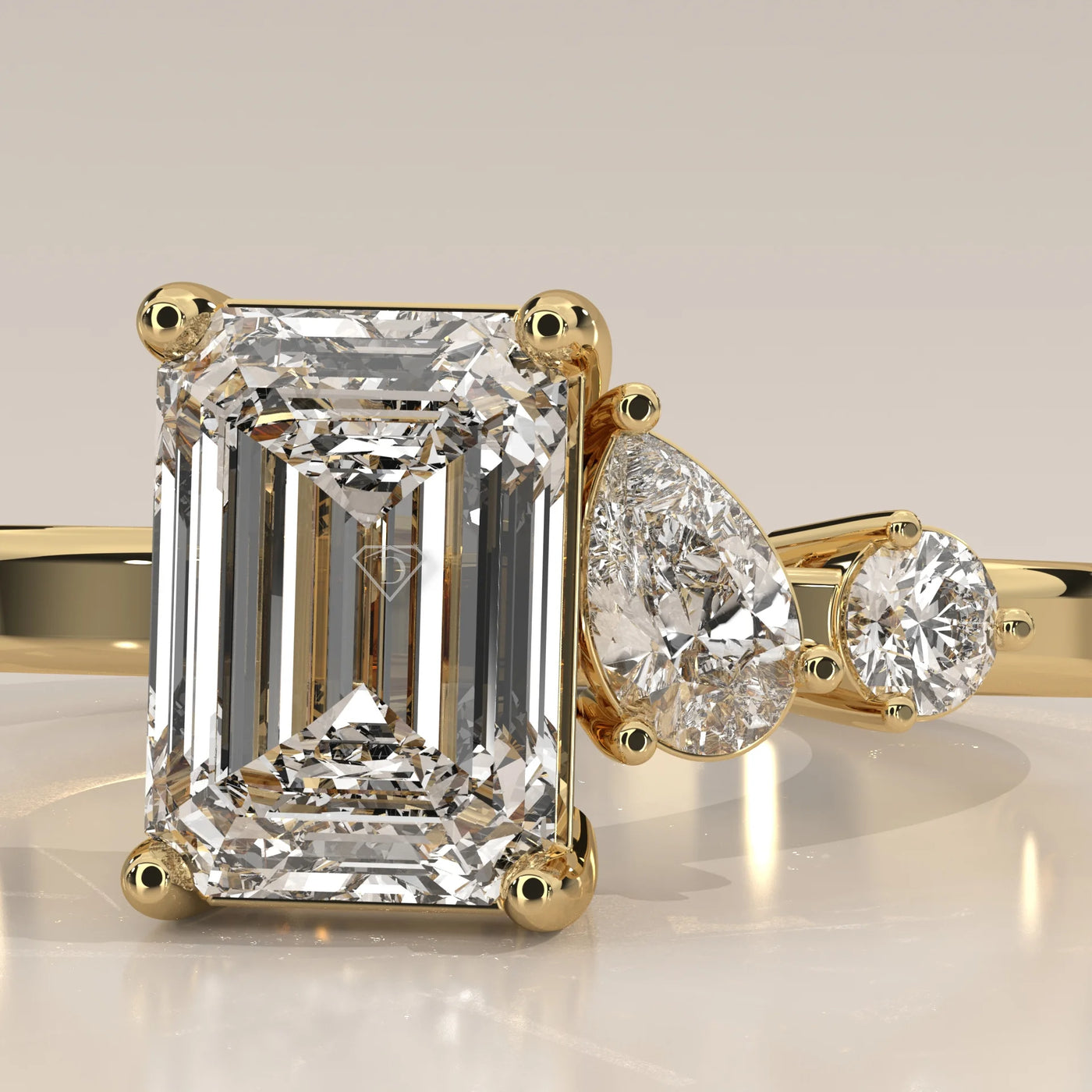 Stone Detail: Emerald Cut Lab Grown Diamonds in Three-Stone Setting – Yellow Gold – Driona Jewels