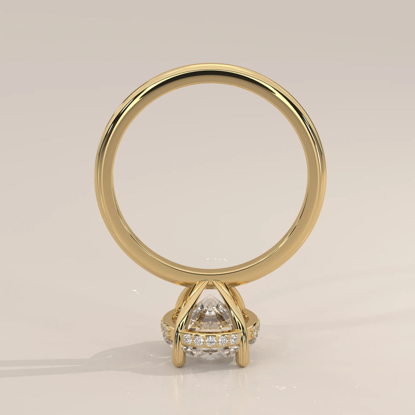 A 14k yellow gold engagement ring with a large center diamond surrounded by smaller diamonds.