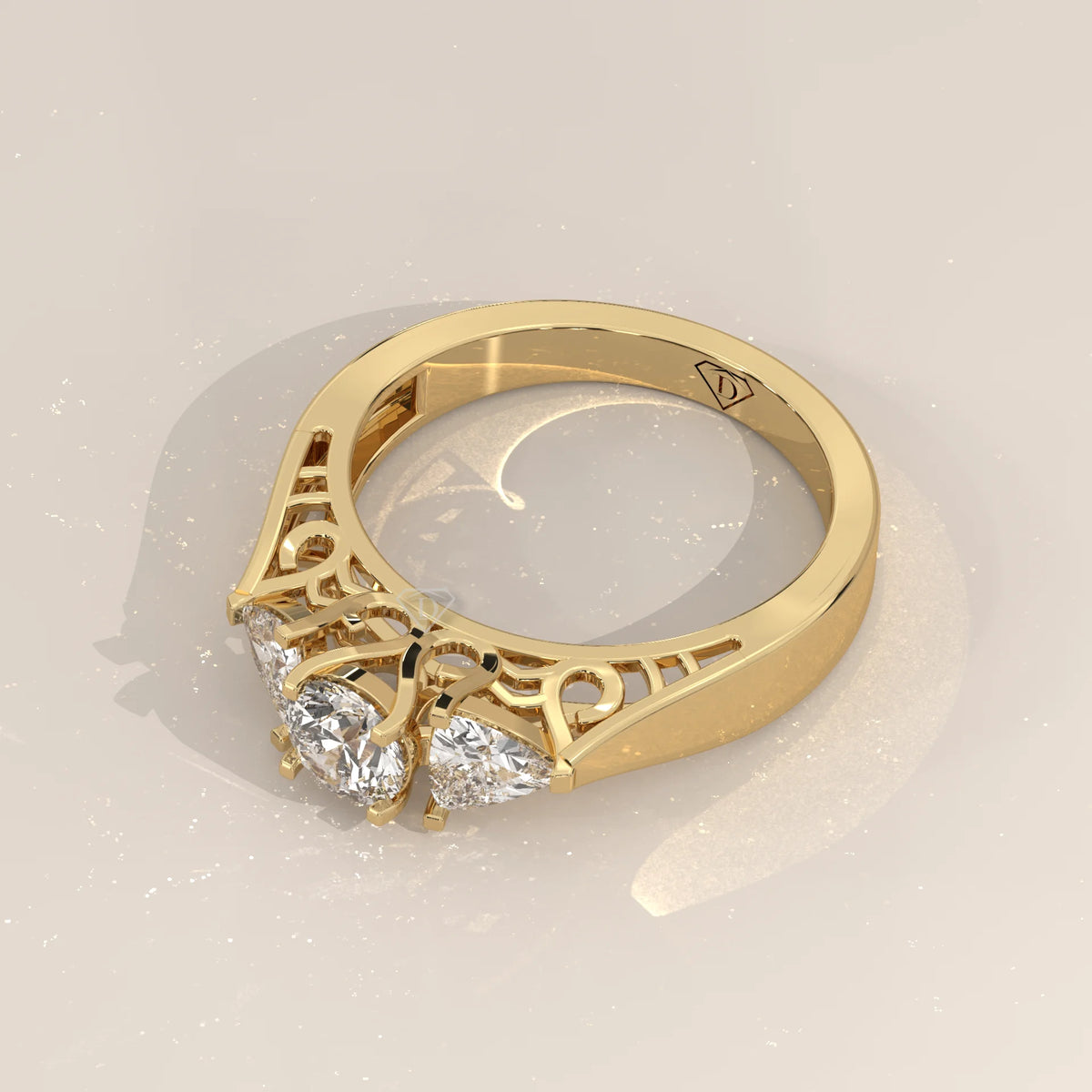 Round and Trillion Lab Grown Diamond Three Stone Filigree Ring in yellow gold, shown from the side.