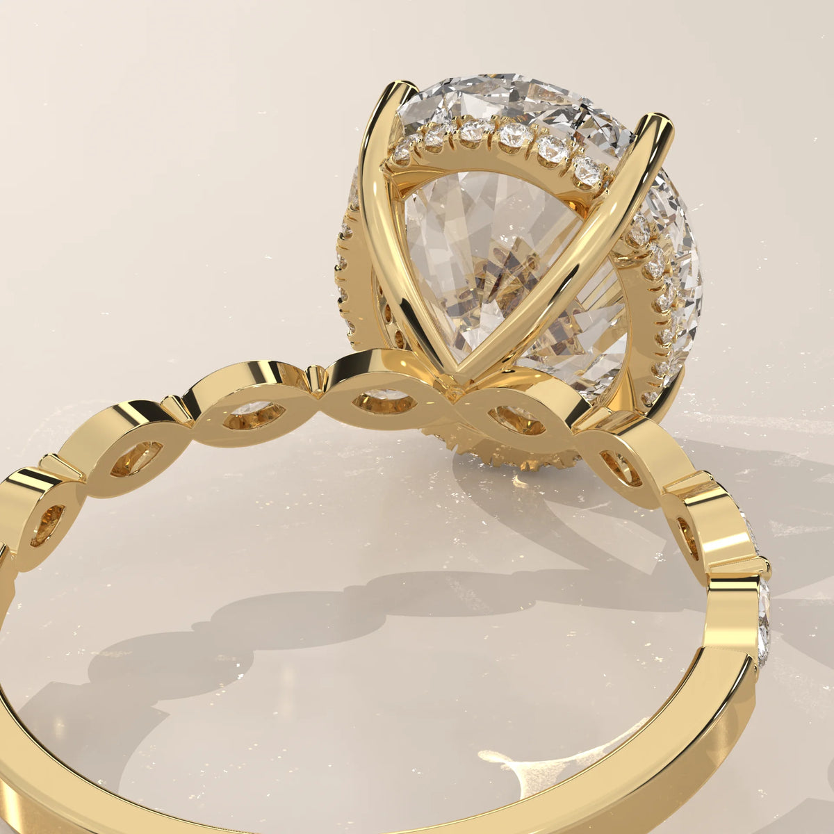 Eria 5 Carat Oval Lab Grown Diamond Ring, Bezel Marquise Band in yellow gold, product photograph on a plain background.
