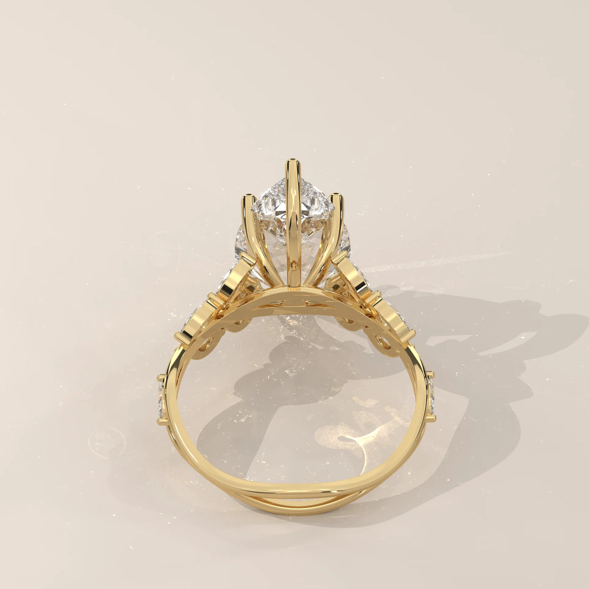 Fiana 5 Carat Pear Lab Grown Diamond Ring, Marquise Vine Band in yellow gold, shown on a plain background.