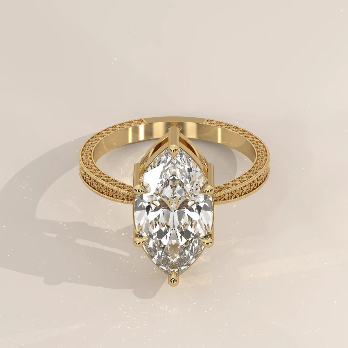 Ginnie 5 Carat Marquise Lab Grown Diamond Ring, Engraved Floral Band in yellow gold, shown from the front.