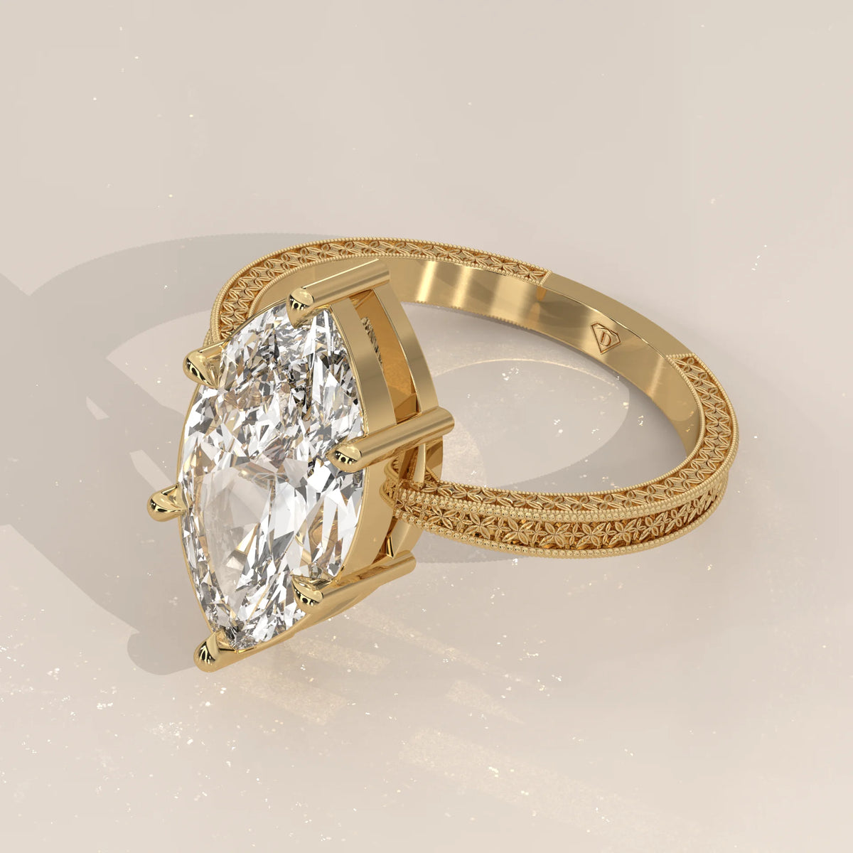 Ginnie 5 Carat Marquise Lab Grown Diamond Ring, Engraved Floral Band in yellow gold, shown from the side.