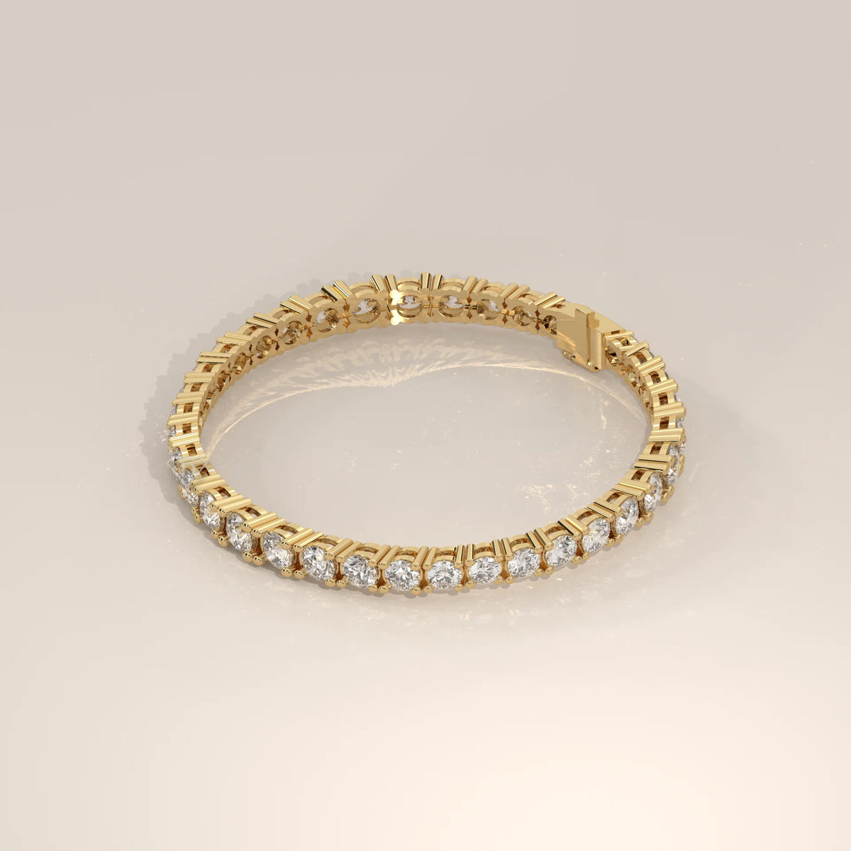 Graduated Round Lab Grown Diamond Tennis Bracelet, Four Prong in yellow gold, shown at an angle.