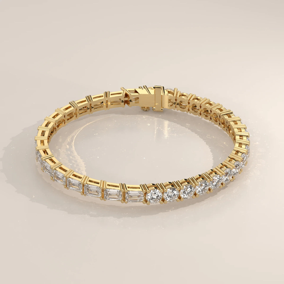 Half Round Half Emerald Cut Lab Grown Diamond Tennis Bracelet in yellow gold, shown on a plain background.