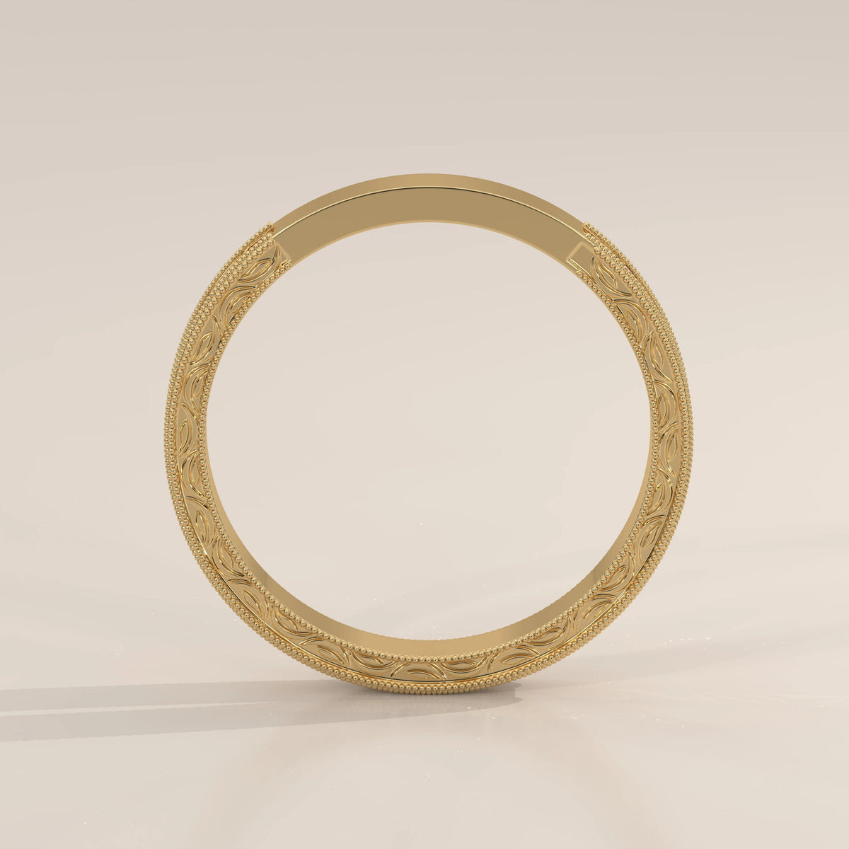 Hand Engraved Acanthus Scroll Gold Band with Milgrain Edges, front view on a plain background.