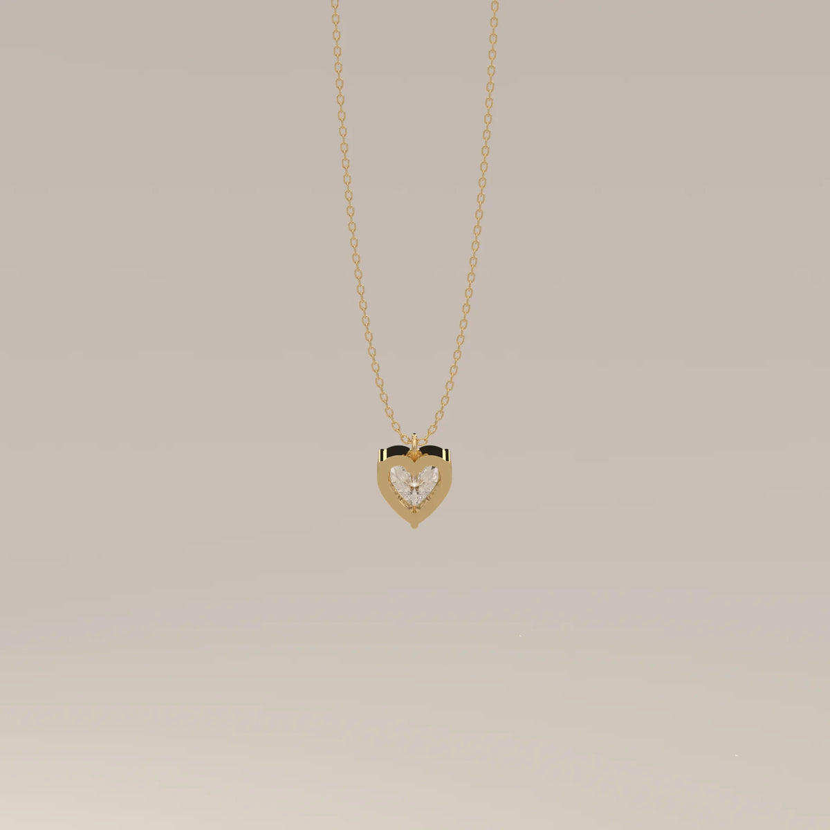 A delicate gold necklace with a heart-shaped diamond pendant.