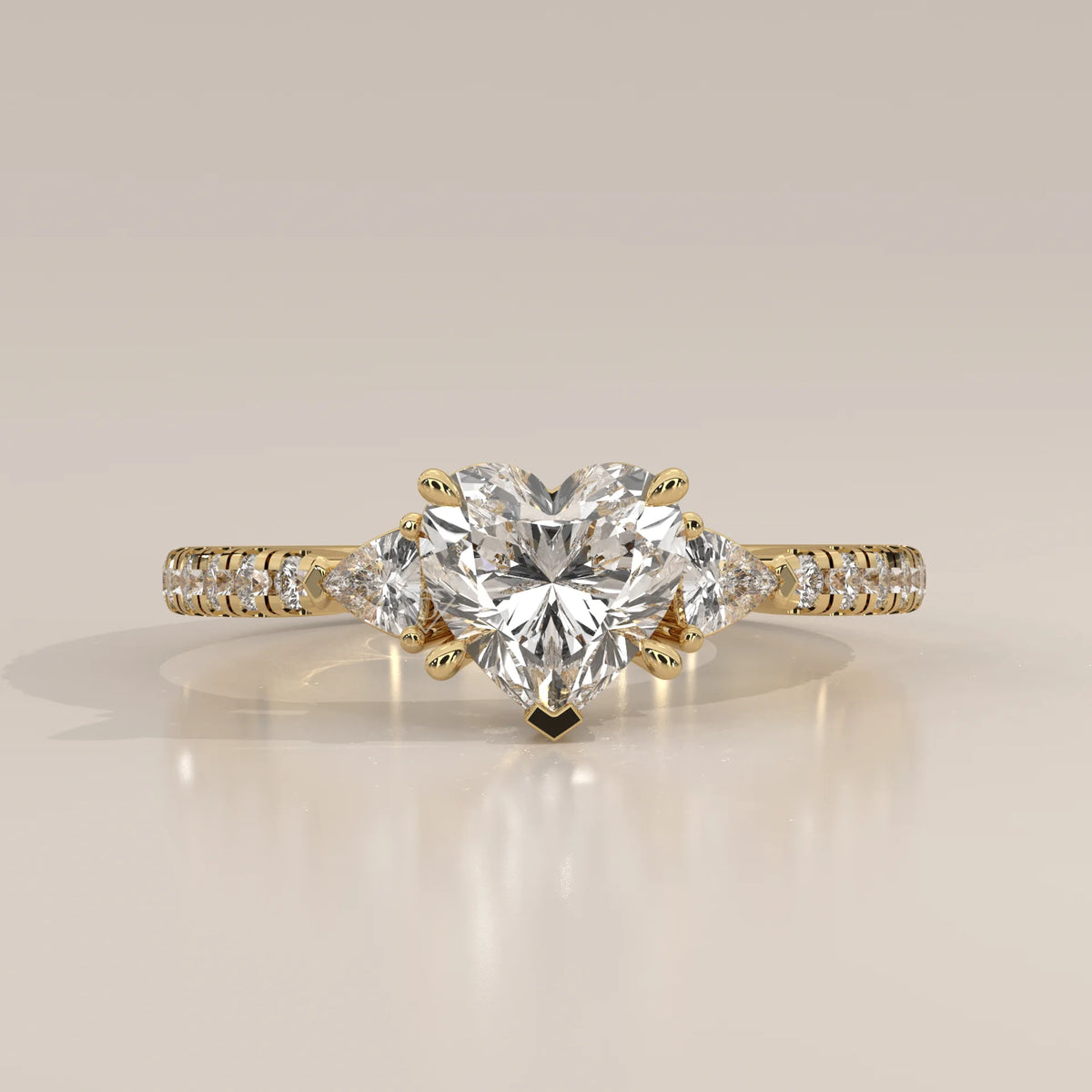 Heart Lab Grown Diamond Three Stone Ring with Trillion Sides in yellow gold, photographed head-on.
