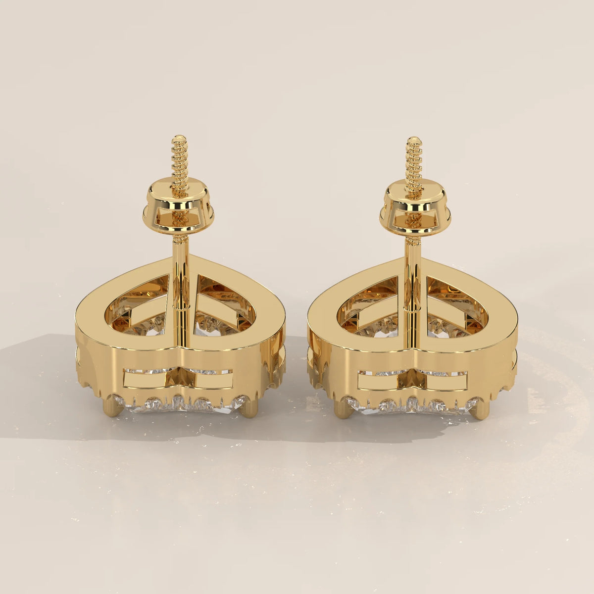 Heart Shape Halo Lab Grown Diamond Stud Earrings with Screw Backs in yellow gold, studio photograph on a plain background.