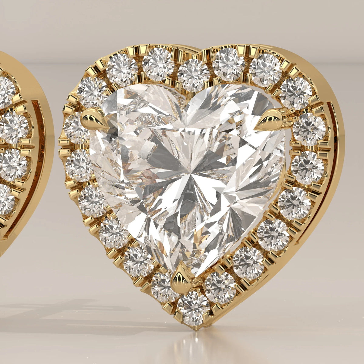 Heart Shape Halo Lab Grown Diamond Stud Earrings with Screw Backs in yellow gold, front view on a plain background.