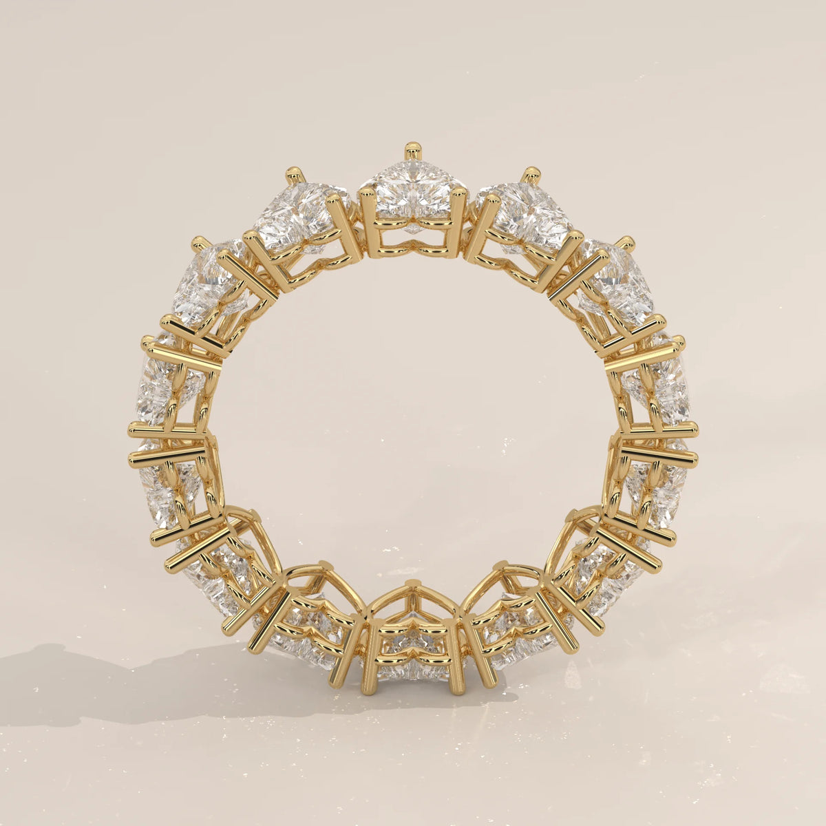 Heart Shaped Lab Grown Diamond Full Eternity Ring in Gold in yellow gold, studio photograph on a plain background.