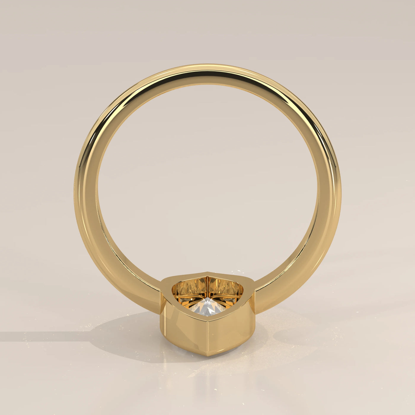 A simple yellow gold ring with a hexagonal-set diamond.