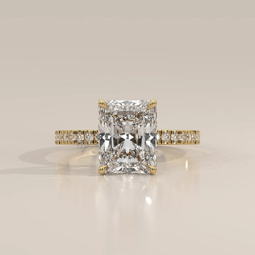 Ivory 5 Carat Radiant Lab Grown Diamond Ring, Hidden Halo Pave Band in yellow gold, photographed head-on.