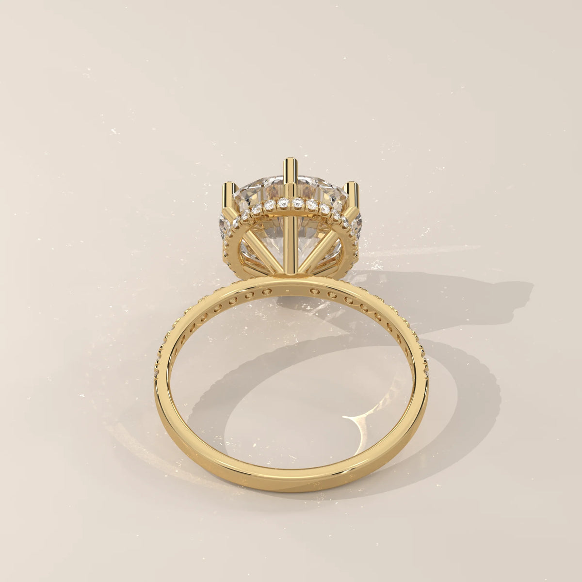 Jlina 5 Carat Round Lab Grown Diamond Ring, Six Claw Hidden Halo in yellow gold, shown from the side.