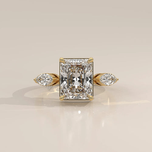 Krace 5 Carat Radiant Lab Grown Diamond Ring, Marquise Three Stone in yellow gold, photographed head-on.