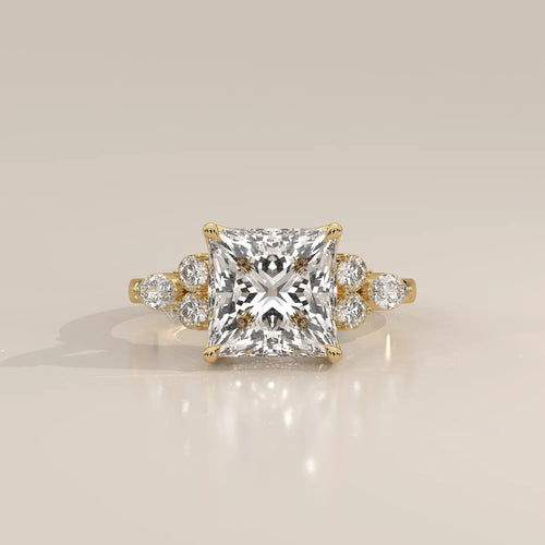 Layrana 5 Carat Princess Lab Grown Diamond Ring, Diamond Clusters in yellow gold, photographed head-on.