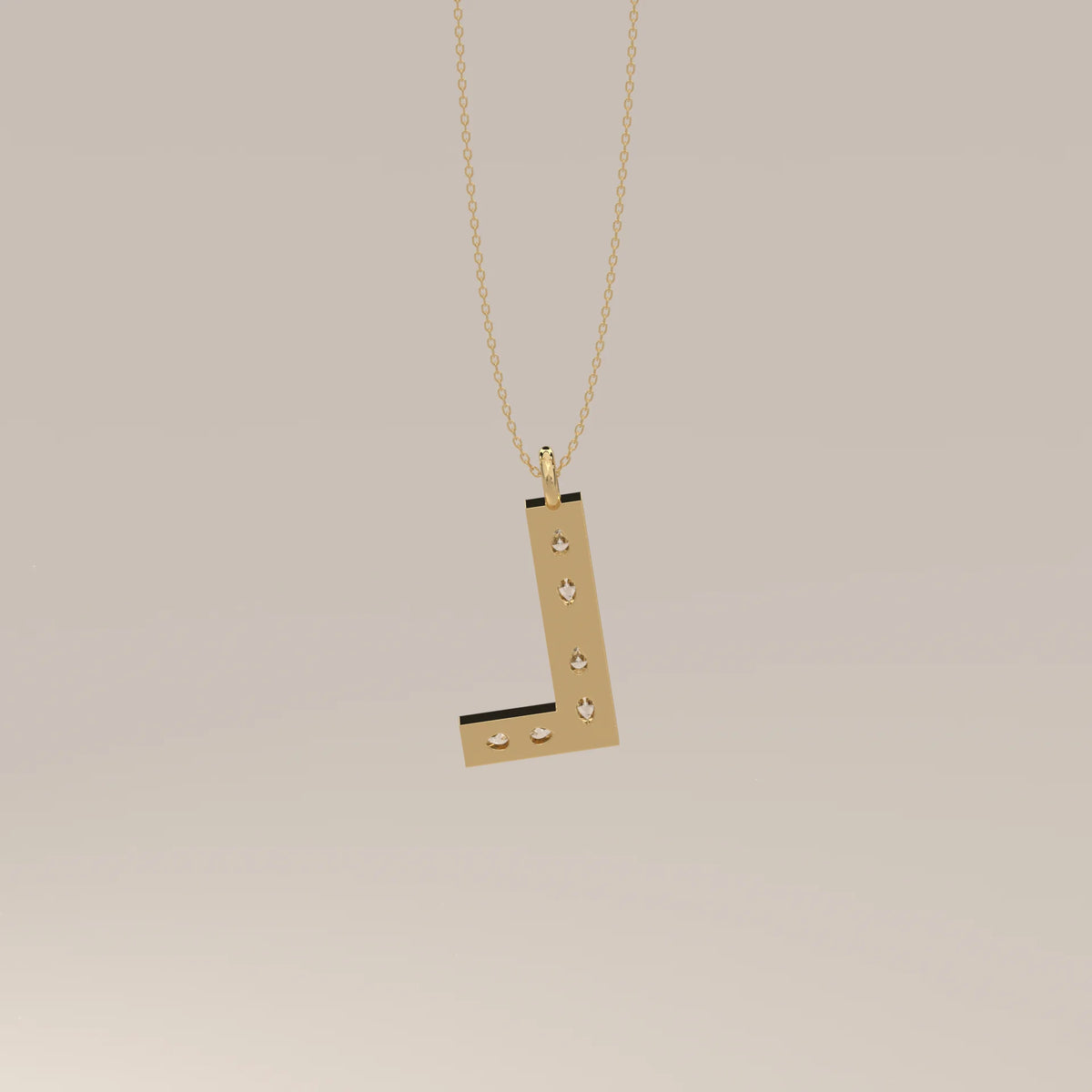 Letter L Initial Pendant with Pear Shaped Lab Grown Diamonds in yellow gold, photographed at a three-quarter angle.
