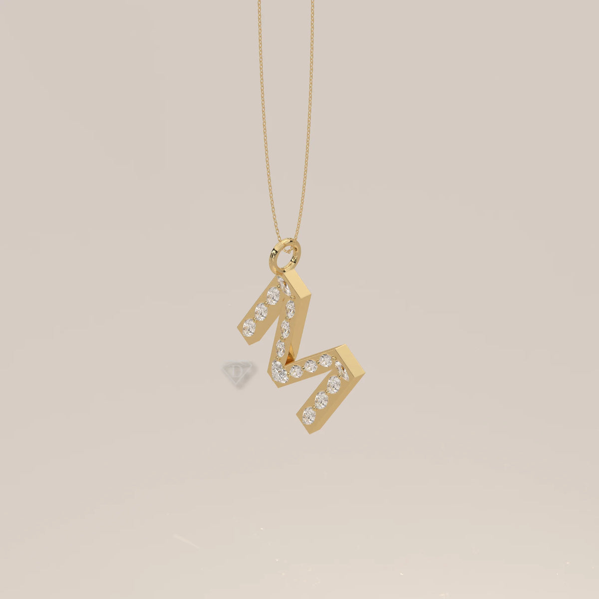 Letter M Initial Pendant with Marquise Lab Grown Diamonds in yellow gold, shown at an angle.