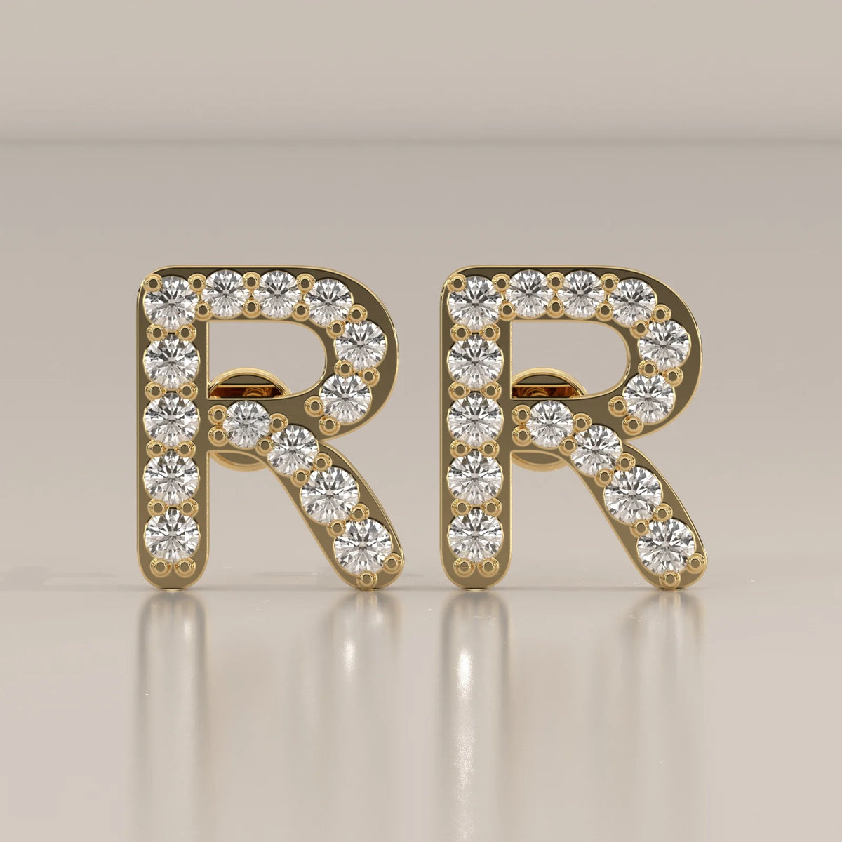 Letter R Initial Pave Lab Grown Diamond Stud Earrings in yellow gold, shown from the front.