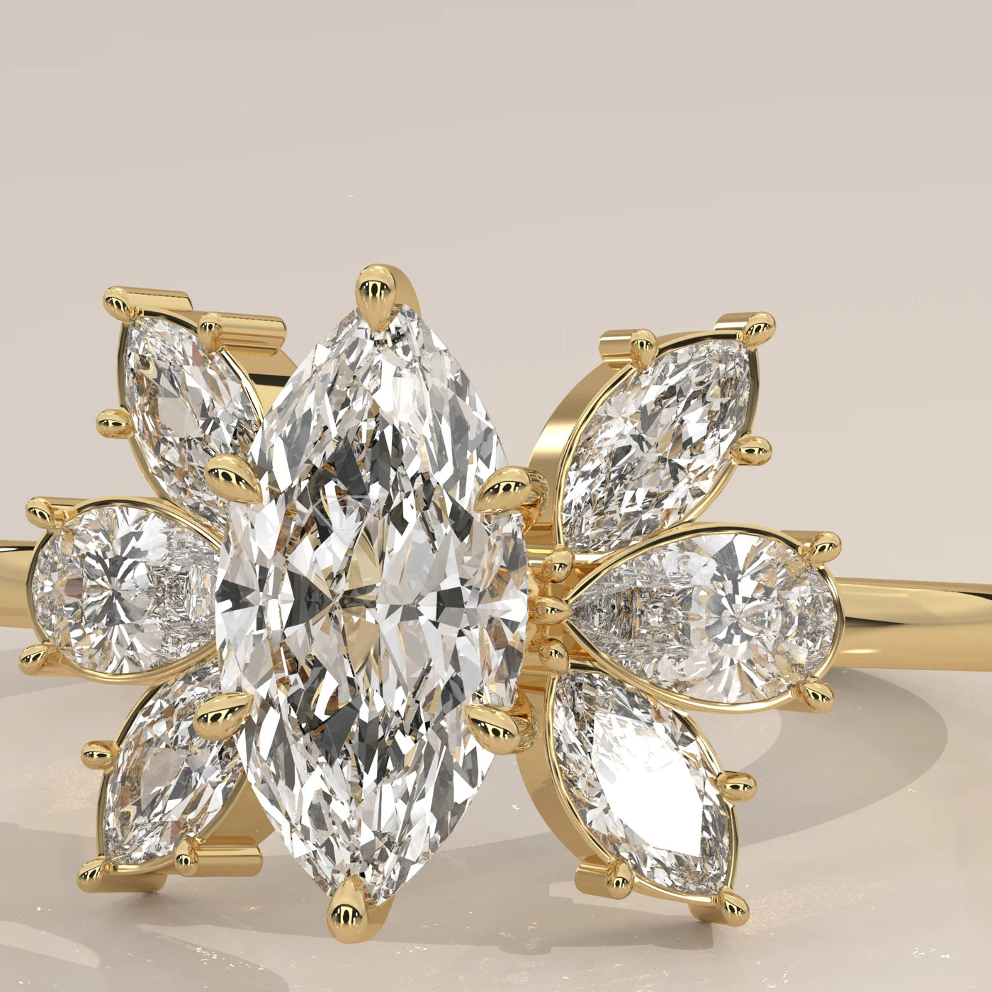 Close-up of a beautiful 14k gold ring with a central marquise diamond surrounded by smaller pear-shaped diamonds.