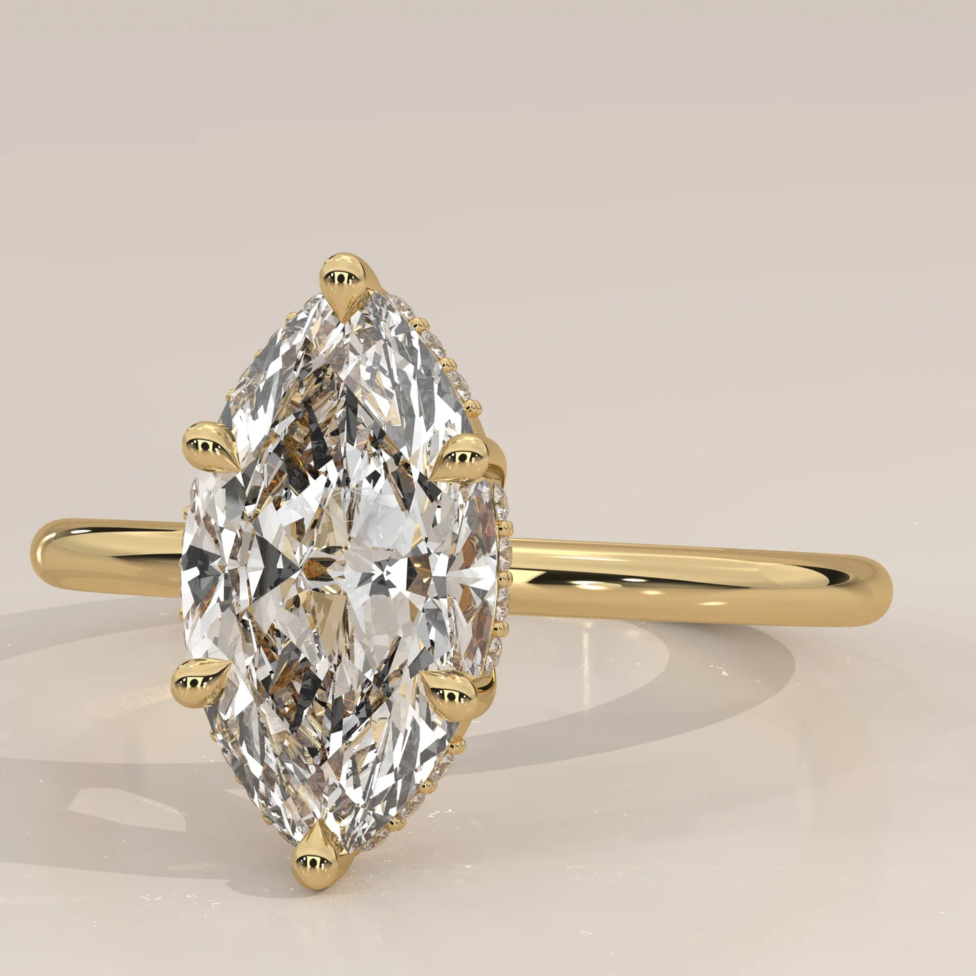 A 14k yellow gold ring with a large marquise-cut diamond and a simple band.