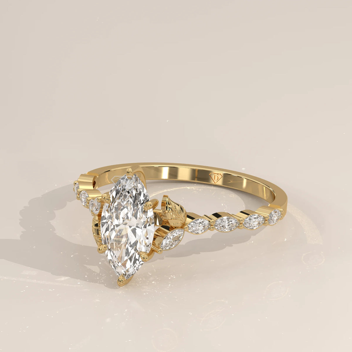 Gold ring with a marquise-cut diamond and ornate band