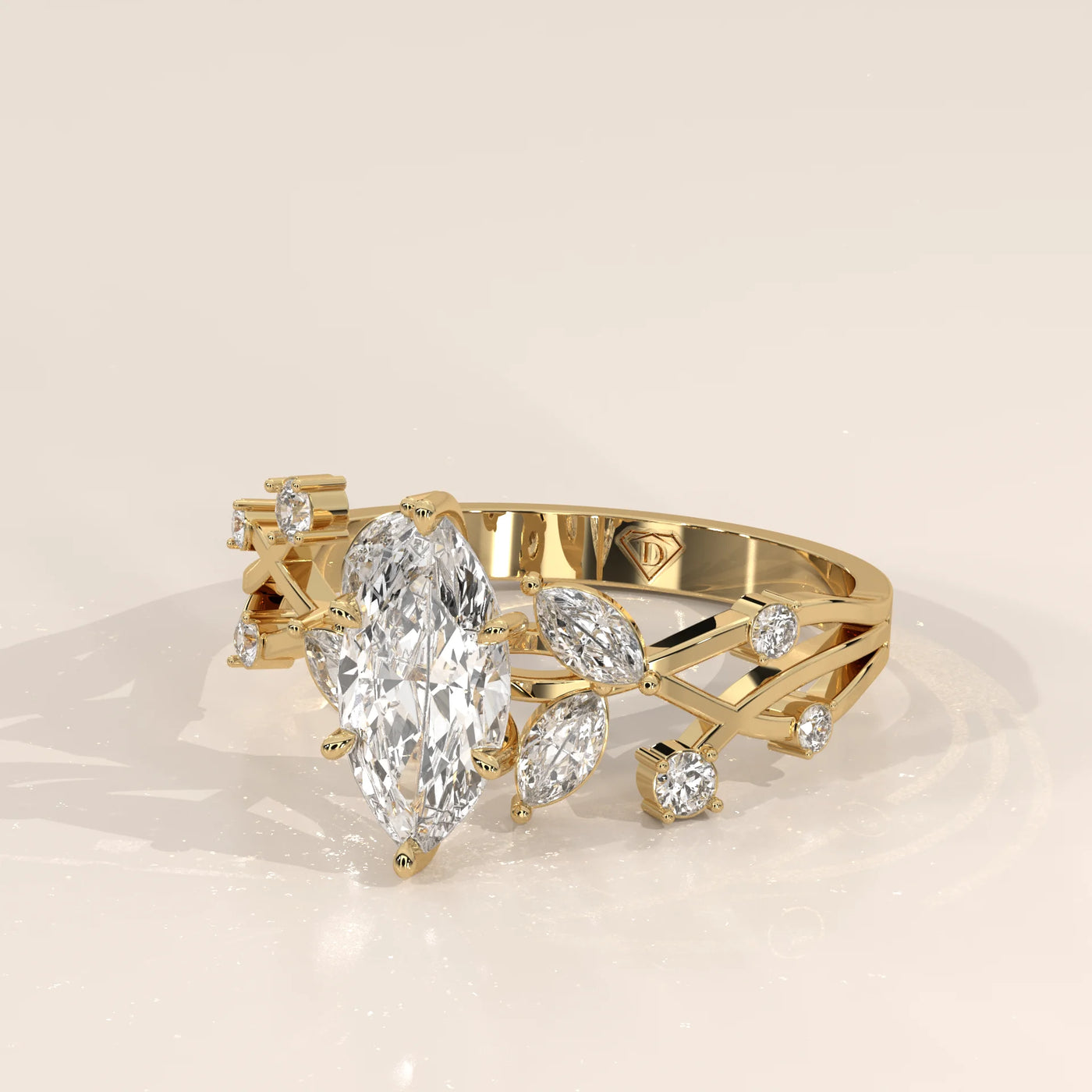 Elegant yellow gold ring with marquise and round diamonds in a leaf design.