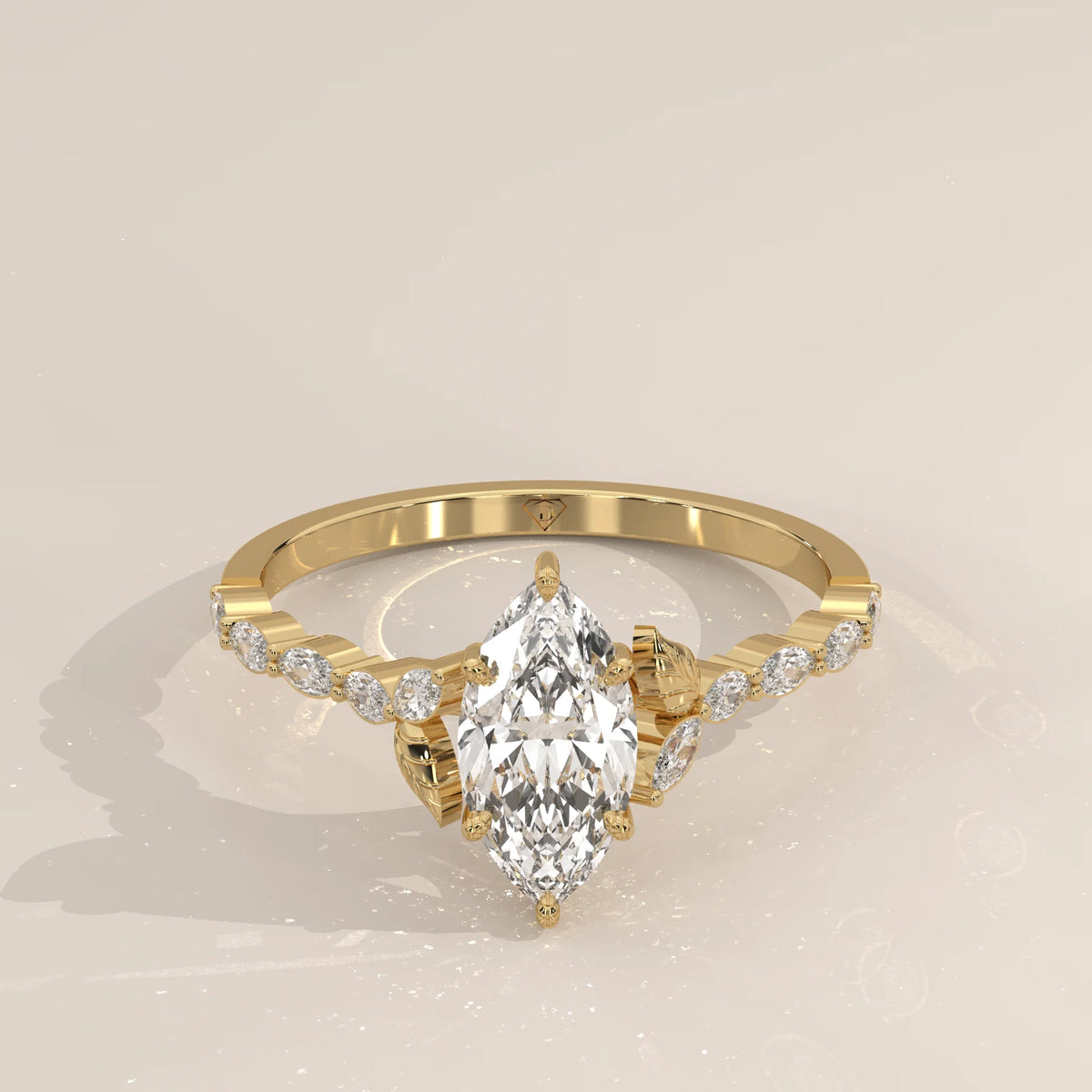 A yellow gold engagement ring with a marquise diamond and accent stones.