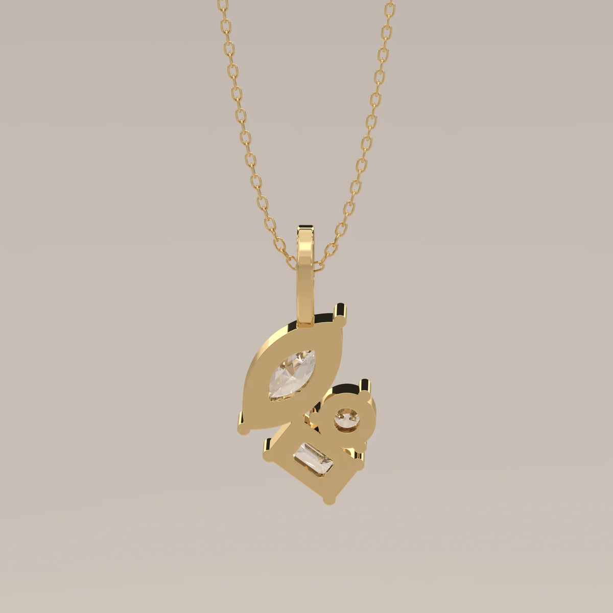 Marquise, Emerald and Round Lab Grown Diamond Cluster Pendant in yellow gold, shown at an angle.