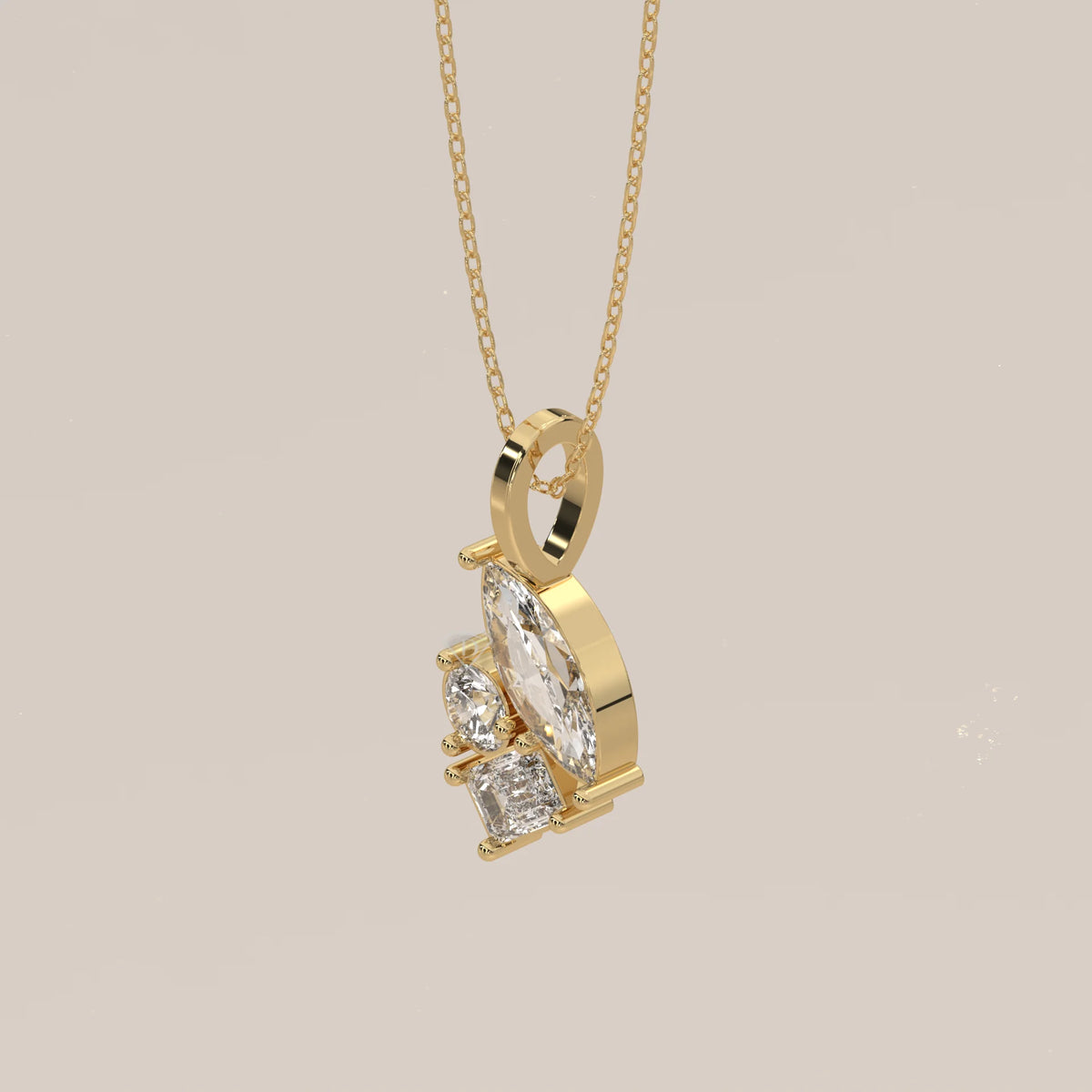 Marquise, Emerald and Round Lab Grown Diamond Cluster Pendant in yellow gold, shown from the side.