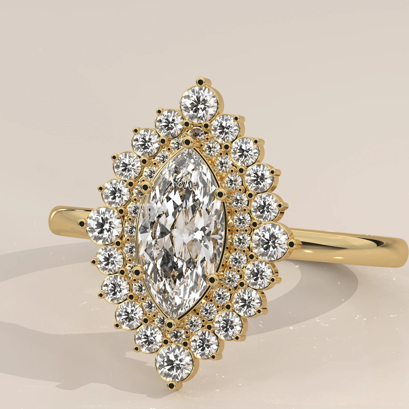 A gold ring featuring a marquise-cut diamond surrounded by a halo of smaller diamonds.