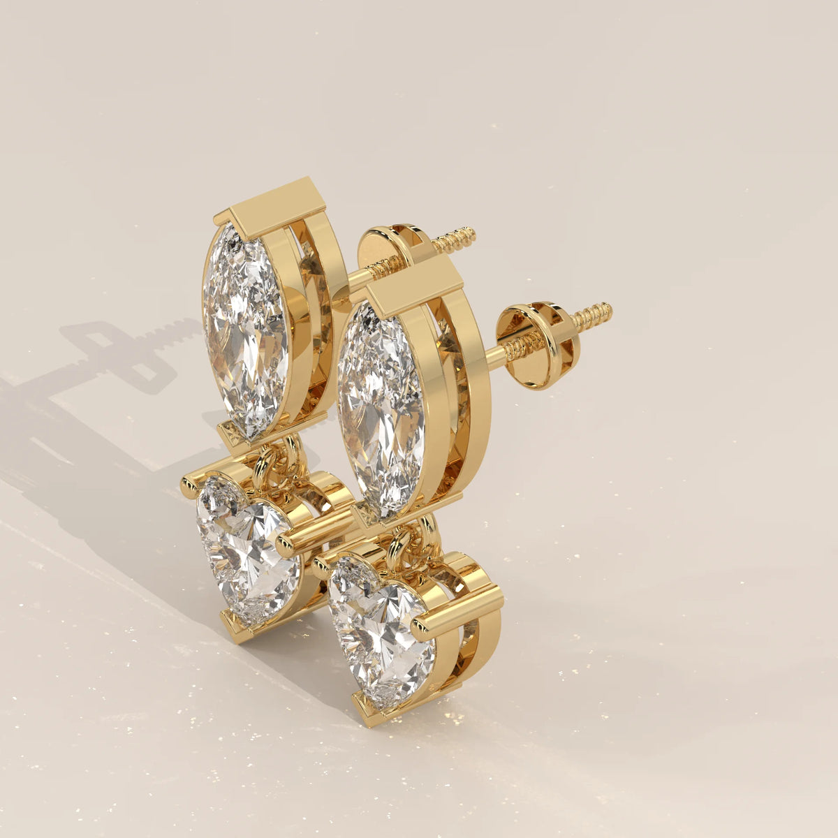 Marquise and Heart Lab Grown Diamond Two Stone Drop Earrings in yellow gold, shown from the side.