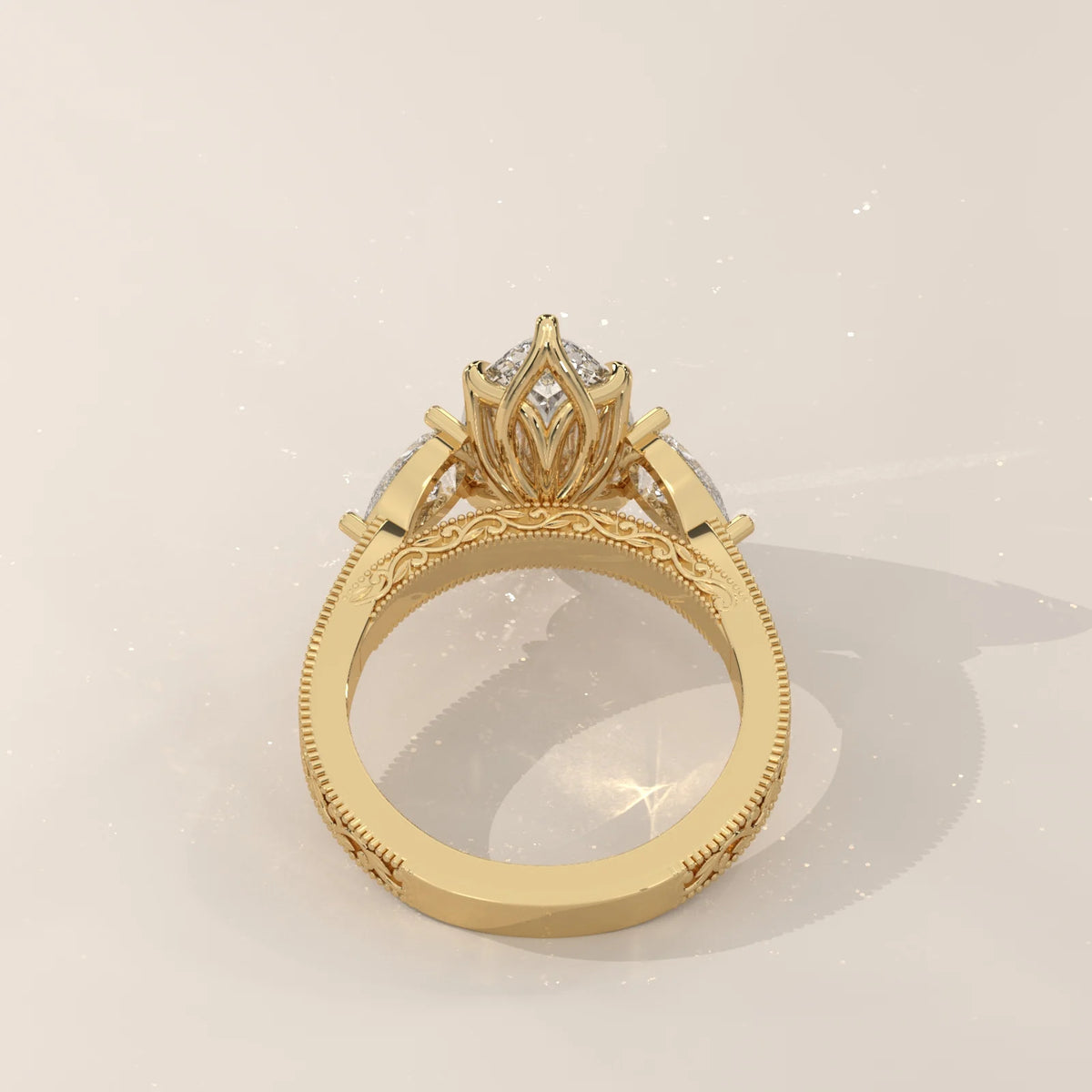 Back view: Marquise Diamond Three Stone Ring with Pear Side Stones and Vintage Engraved Band in 14K Yellow Gold – Lab Grown – Driona Jewels